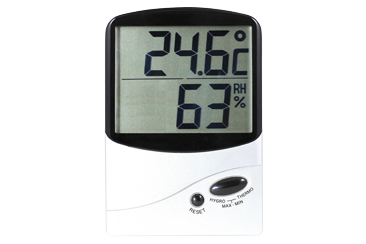 Digital hygrometer and thermometer displaying 24.6 degrees Celsius and 63 percent relative humidity.