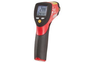 A hand using a digital infrared thermometer to measure the surface temperature of a home water pipe.